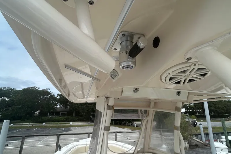 Slide: The Image of 2016 Cobia 296 Center Console boat with T-top and speaker system. - 33