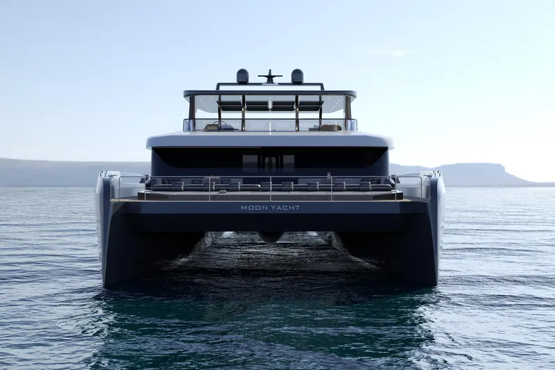 Slide: The Image of Front view of 2027 Moon 9ty yacht on calm sea, showcasing sleek design and luxury features. - 20