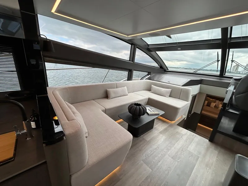 Slide: The Image of Aerial view of 2025 Pearl 63 yacht cruising on clear blue water. - 10