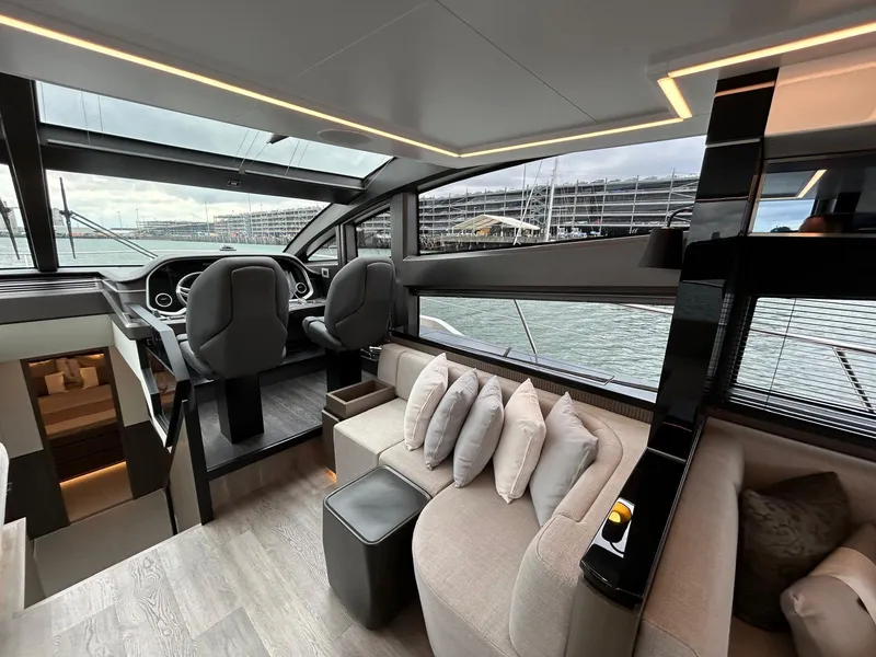Slide: The Image of Luxurious interior of 2025 Pearl 63 yacht with modern kitchen and dining area. - 11