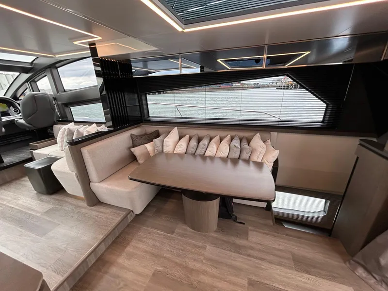 Slide: The Image of Luxurious interior of 2025 Pearl 63 yacht with modern kitchen and seating area. - 13
