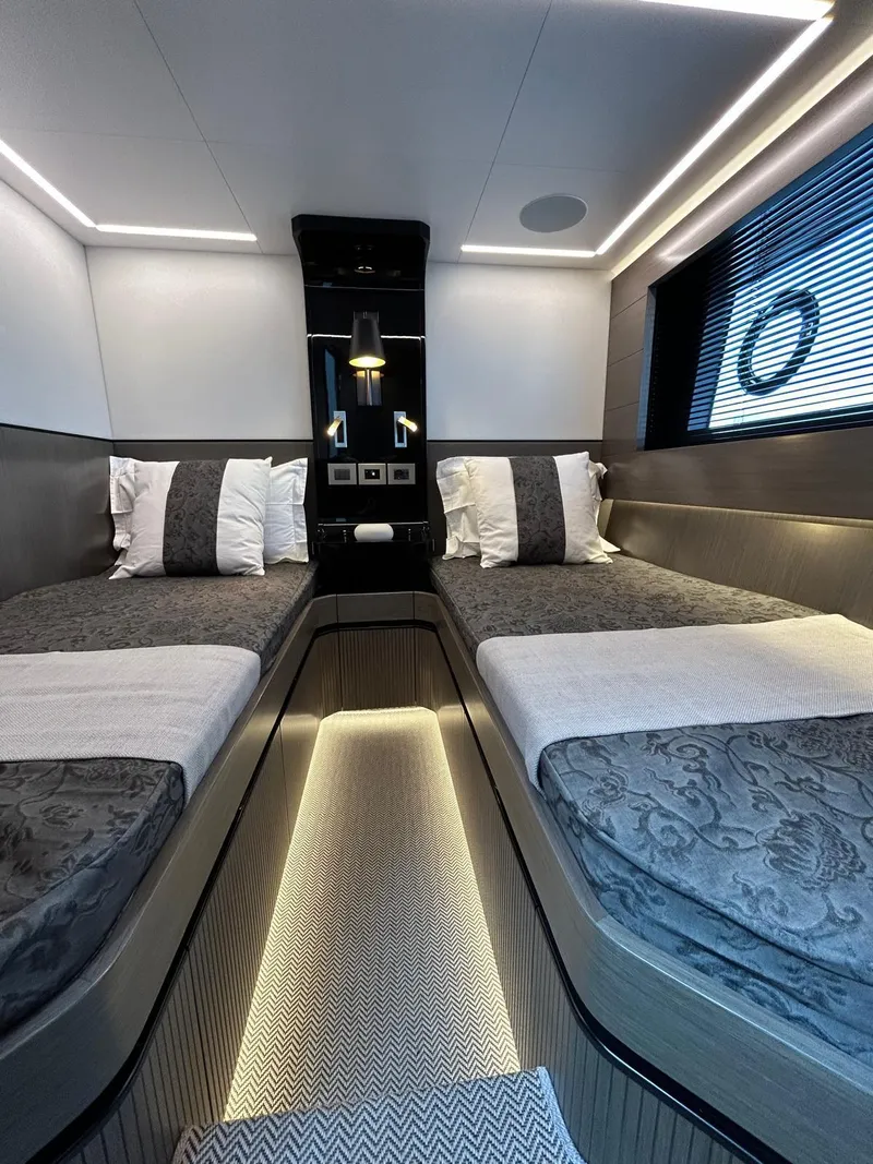 Slide: The Image of Luxurious interior of 2025 Pearl 63 yacht with modern seating and panoramic ocean views. - 17