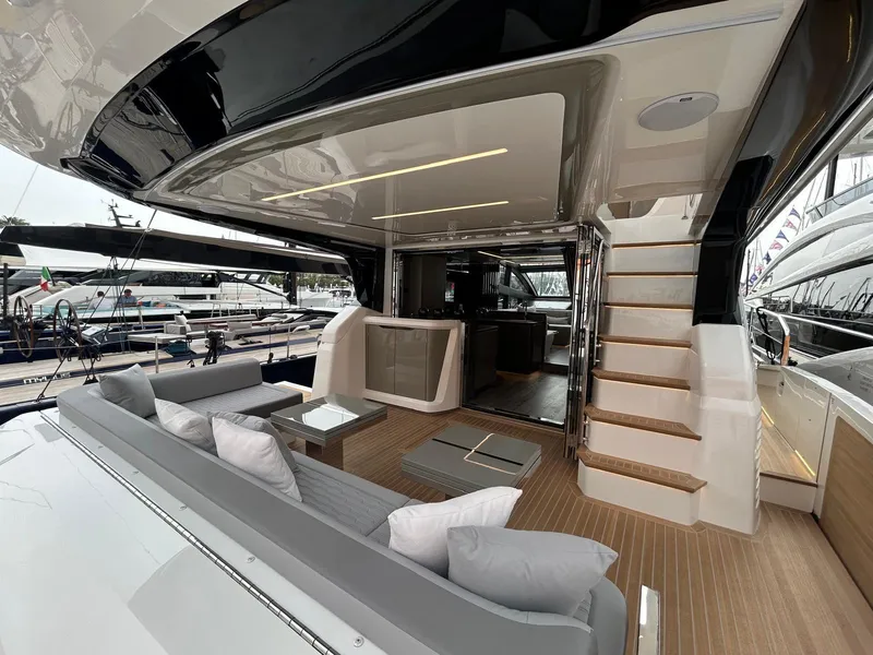 Slide: The Image of Luxurious interior of 2025 Pearl 63 yacht with modern seating and control panel. - 19