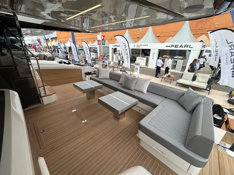Slide: The Image of Luxurious interior of 2025 Pearl 63 yacht with ocean view and elegant seating area. - 21