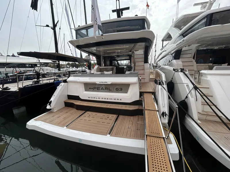 Slide: The Image of Modern helm of 2025 Pearl 63 yacht with sleek design and advanced controls. - 23