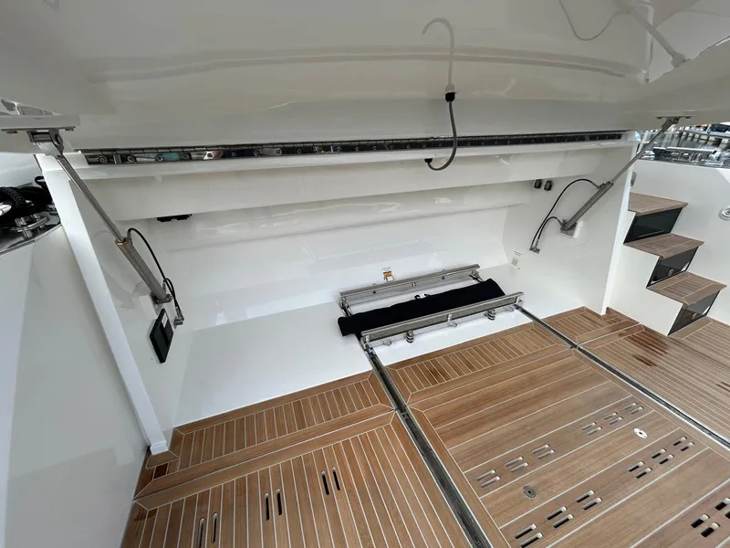 Slide: The Image of Cockpit of 2025 Pearl 63 yacht with modern steering and digital controls. - 24