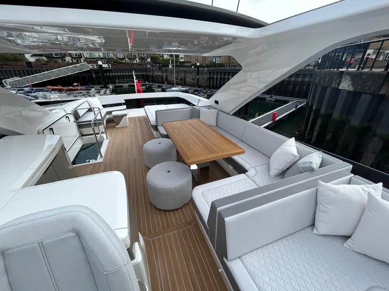 Slide: The Image of Interior of 2025 Pearl 63 yacht cockpit with modern steering and seating. - 25