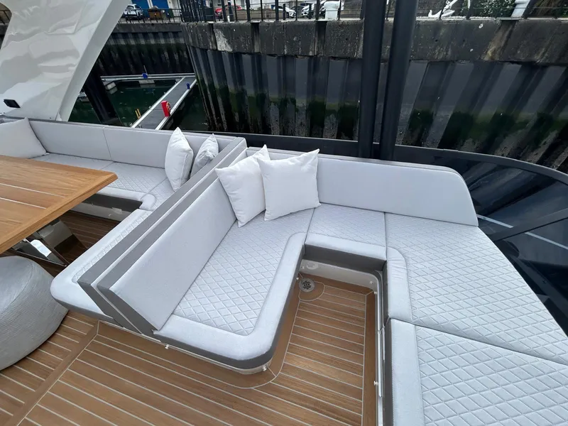 Slide: The Image of Interior of 2025 Pearl 63 yacht, featuring modern design and luxurious seating. - 28