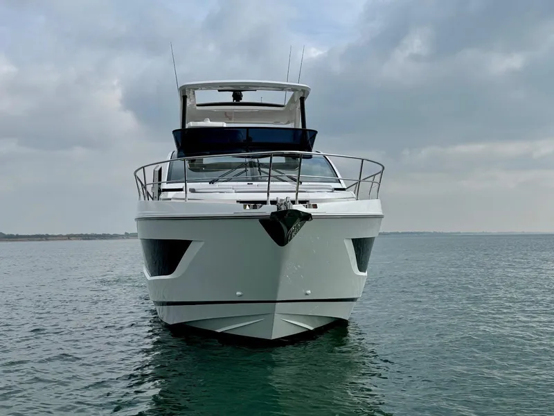 Slide: The Image of 2025 Pearl 63 yacht on blue ocean with city skyline in background. - 3