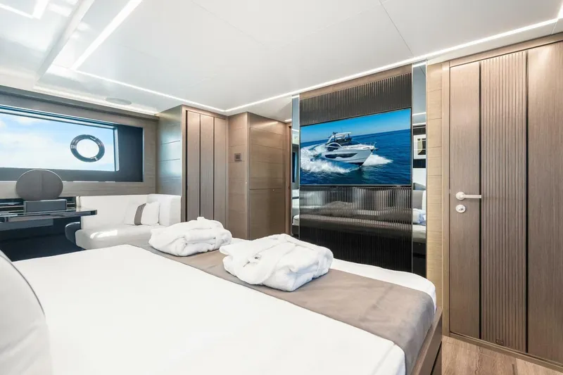 Slide: The Image of Luxurious bedroom interior of 2025 Pearl 63 yacht with modern design and ocean view. - 39