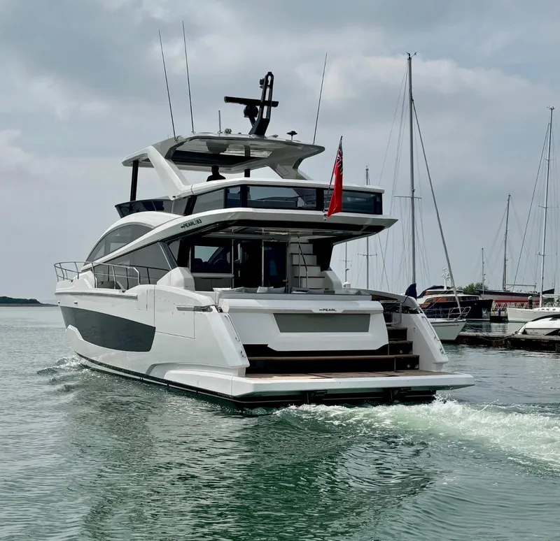 Slide: The Image of Luxury Pearl 63 yacht cruising in clear blue ocean, 2025 model. - 4