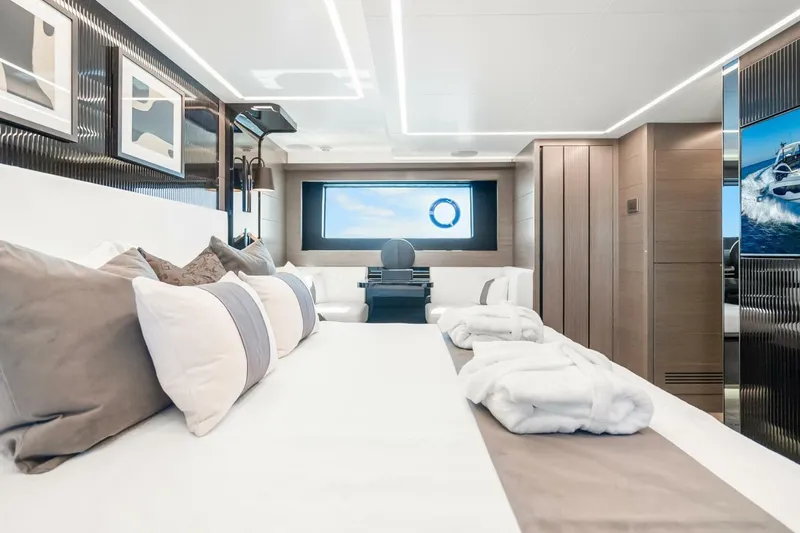 Slide: The Image of Luxurious interior of 2025 Pearl 63 yacht with elegant bedding and modern decor. - 40