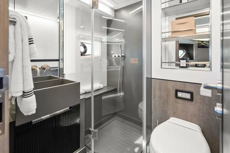 Slide: The Image of Modern bathroom in 2025 Pearl 63 yacht, featuring sleek fixtures and glass shower enclosure. - 45