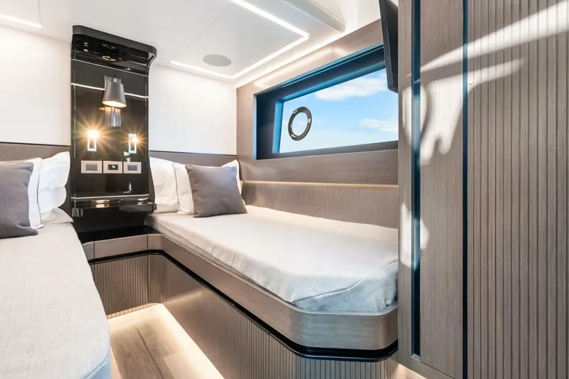 Slide: The Image of Luxurious interior of 2025 Pearl 63 yacht cabin with modern design and ambient lighting. - 49