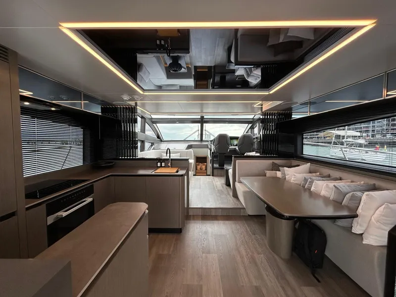 Slide: The Image of 2025 Pearl 63 yacht cruising on clear blue ocean waters. - 5