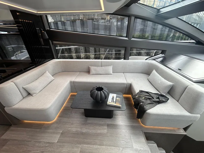 Slide: The Image of Luxurious 2025 Pearl 63 yacht with spacious deck, elegant seating, and ocean view. - 8