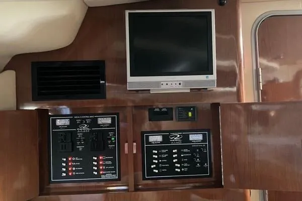 Slide: The Image of 2007 Regal 3060 Window Express interior with control panels and mounted TV. - 17