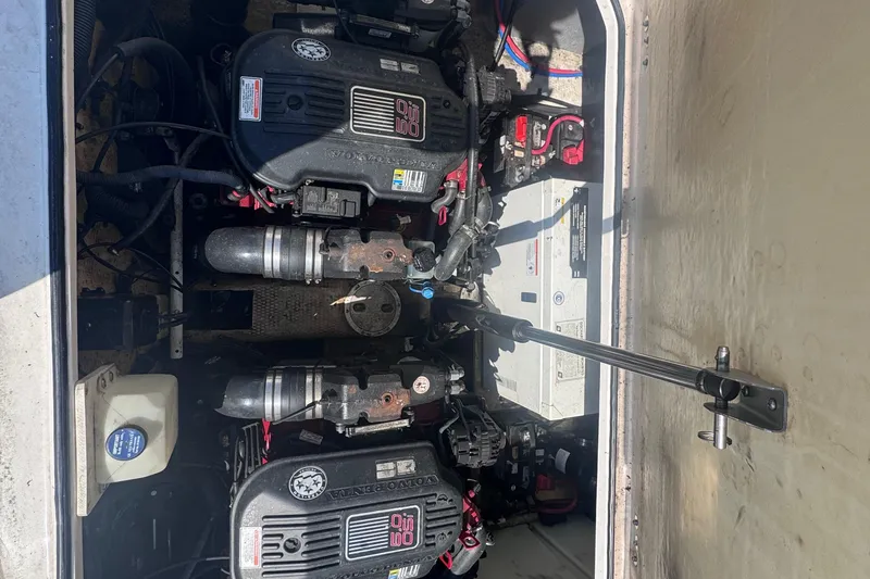 Slide: The Image of Engine compartment of a 2007 Regal 3060 Window Express boat, featuring dual Volvo Penta engines. - 24