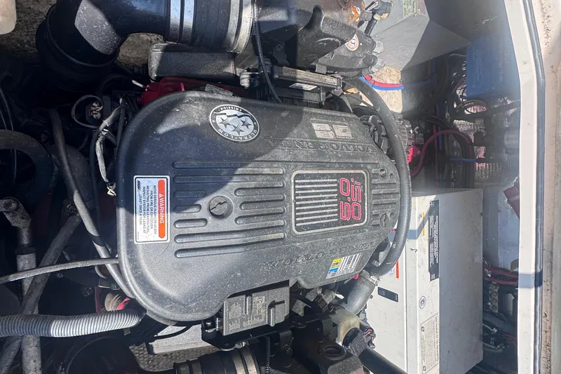 Slide: The Image of Engine compartment of a 2007 Regal 3060 Window Express boat, featuring Volvo Penta components. - 25