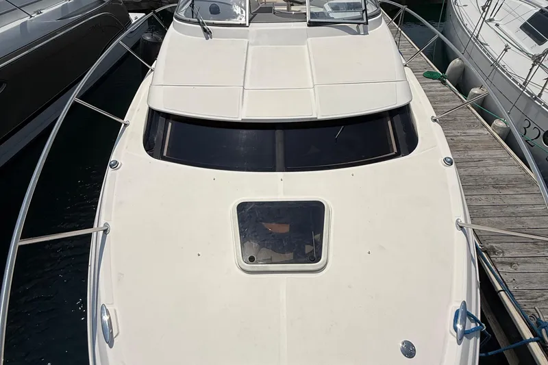 Slide: The Image of 2007 Regal 3060 Window Express boat docked at marina, top view. - 9