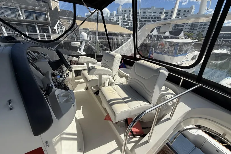 Slide: The Image of 2006 Carver 38 Super Sport yacht interior with helm and seating area. - 6