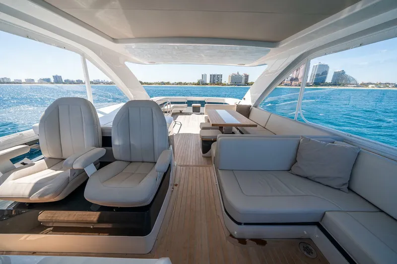 Slide: The Image of Luxurious 2023 Pearl 62 yacht interior with plush seating and ocean view. - 43