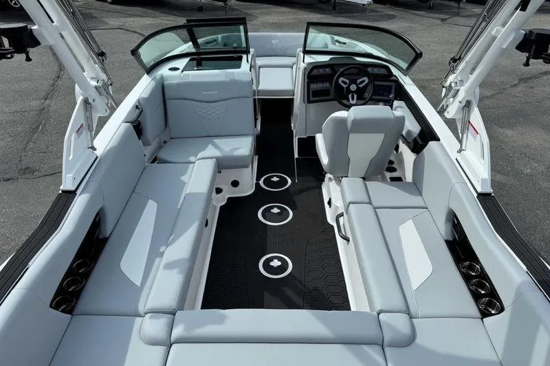 Slide: The Image of 2026 MasterCraft NXT22 boat interior with sleek seating and modern dashboard design. - 4