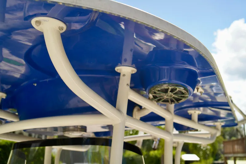 Slide: The Image of 2019 Carolina Skiff Sea Chaser 27 HFC boat canopy with blue finish and speaker detail. - 12