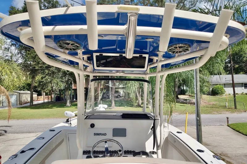 Slide: The Image of 2019 Carolina Skiff Sea Chaser 27 HFC boat with blue T-top and Simrad electronics. - 14