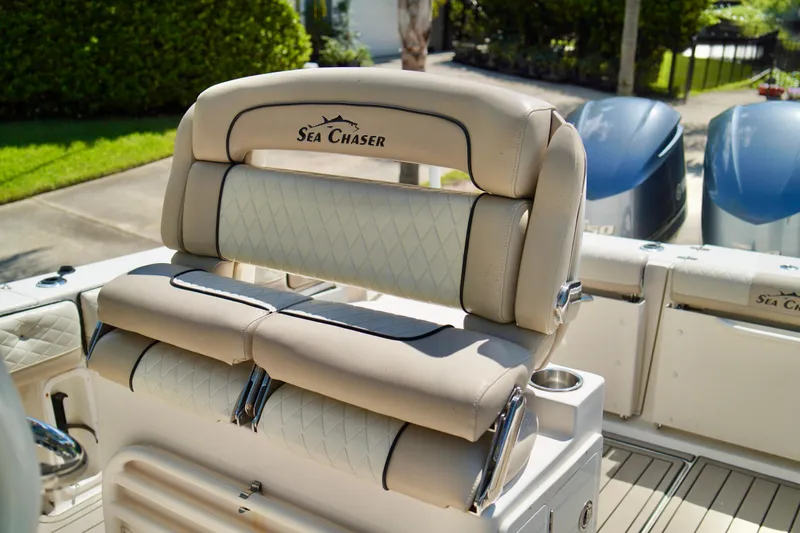 Slide: The Image of 2019 Carolina Skiff Sea Chaser 27 HFC boat seating with dual engines in background. - 17