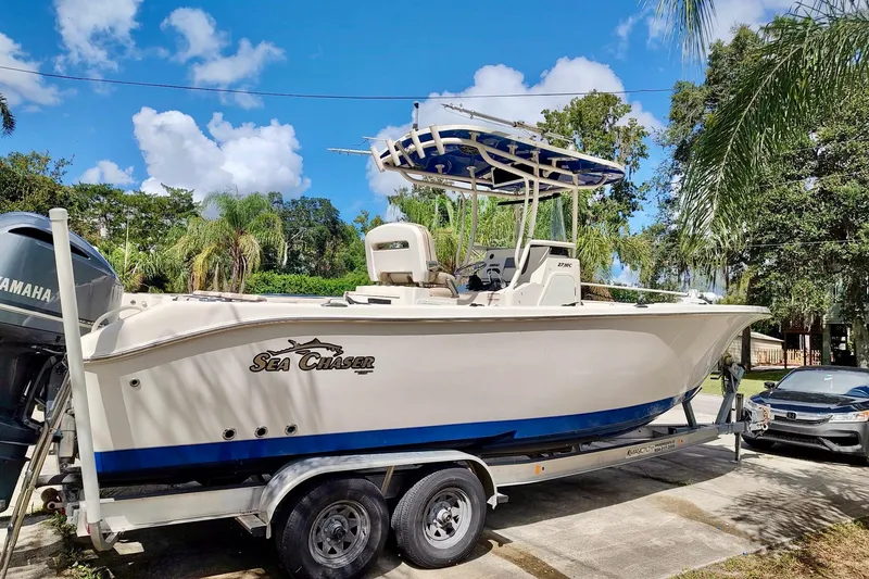 Slide: The Image of 2019 Carolina Skiff Sea Chaser 27 HFC boat on trailer, parked outdoors. - 22