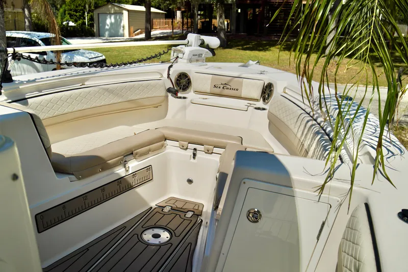 Slide: The Image of 2019 Carolina Skiff Sea Chaser 27 HFC boat interior with seating and storage. - 4