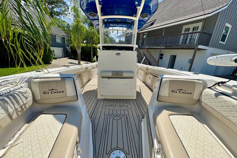 Slide: The Image of 2019 Carolina Skiff Sea Chaser 27 HFC boat interior with seating and console. - 7