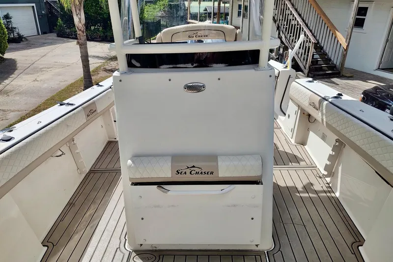 Slide: The Image of 2019 Carolina Skiff Sea Chaser 27 HFC boat interior with seating and console. - 8