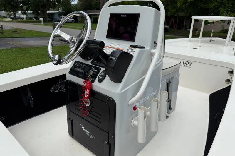 Slide: The Image of 2021 Maverick 17 HPX-S boat console with steering wheel and electronic controls. - 11