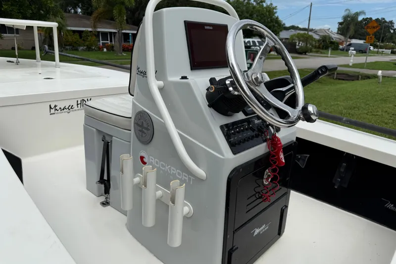 Slide: The Image of 2021 Maverick 17 HPX-S boat console with steering wheel and control panel. - 12