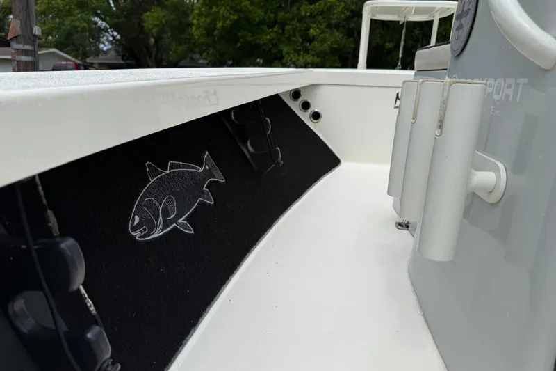 Slide: The Image of 2021 Maverick 17 HPX-S boat interior with fish graphic and rod holders. - 15