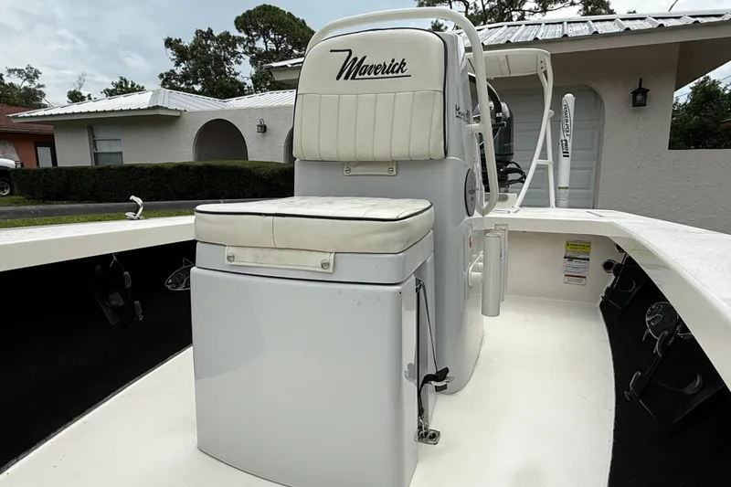 Slide: The Image of 2021 Maverick 17 HPX-S boat interior with cushioned seating and console. - 16