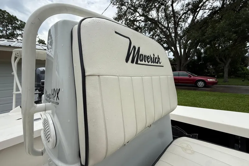 Slide: The Image of 2021 Maverick 17 HPX-S boat seat with logo, outdoors, wet from rain. - 18