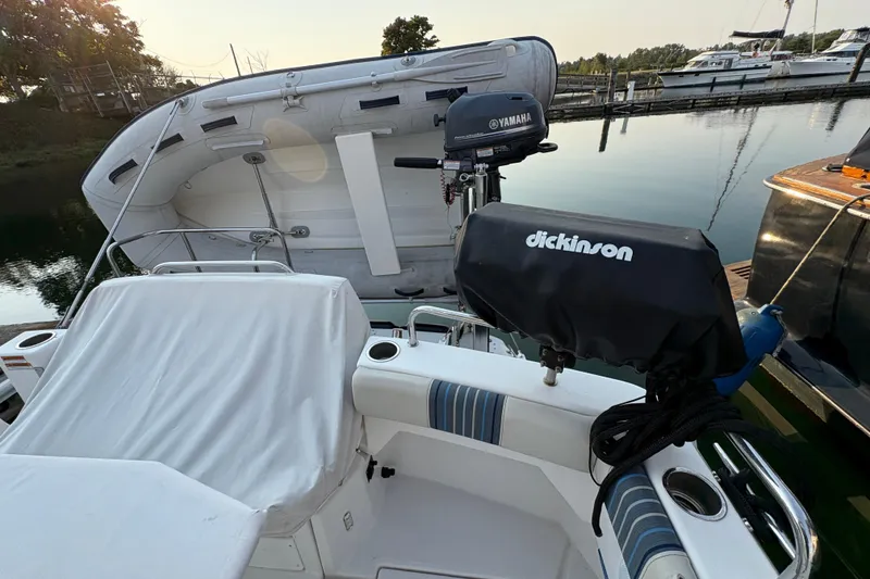 Slide: The Image of 2018 Cutwater C-30 CB boat with Yamaha motor and Dickinson grill at a marina. - 11