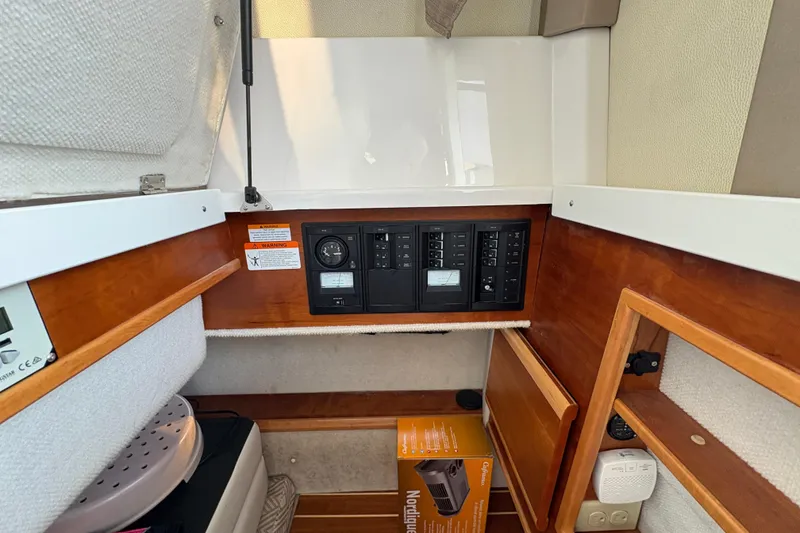 Slide: The Image of 2018 Cutwater C-30 CB interior with control panel and storage compartments. - 23