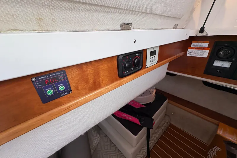 Slide: The Image of 2018 Cutwater C-30 CB interior with control panels and wooden trim. - 24