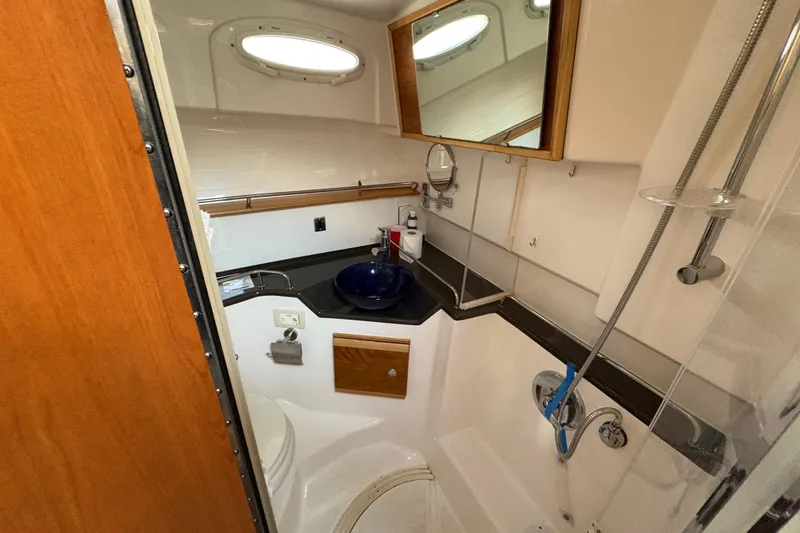 Slide: The Image of 2018 Cutwater C-30 CB boat bathroom with sink, mirror, and shower. - 35