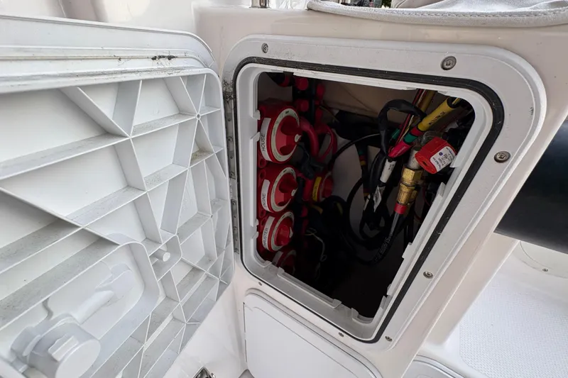 Slide: The Image of 2018 Cutwater C-30 CB boat electrical panel with wiring and switches. - 46