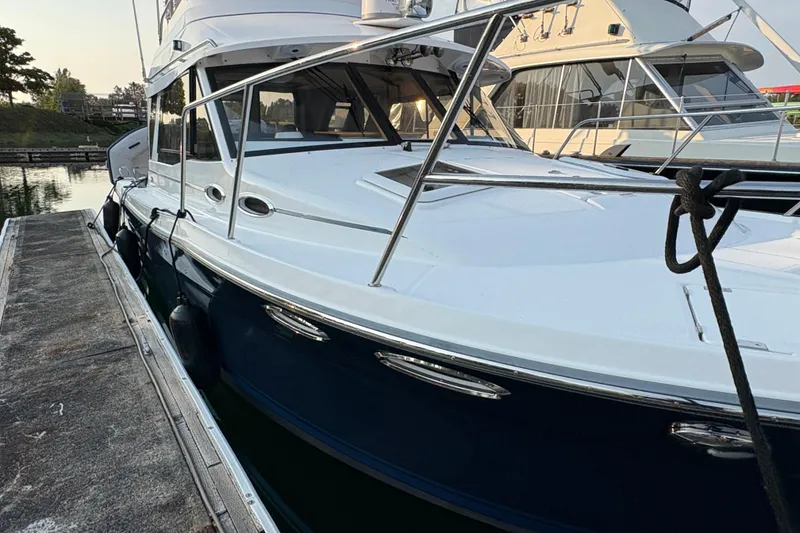 Slide: The Image of 2018 Cutwater C-30 CB boat docked at marina, side view. - 5