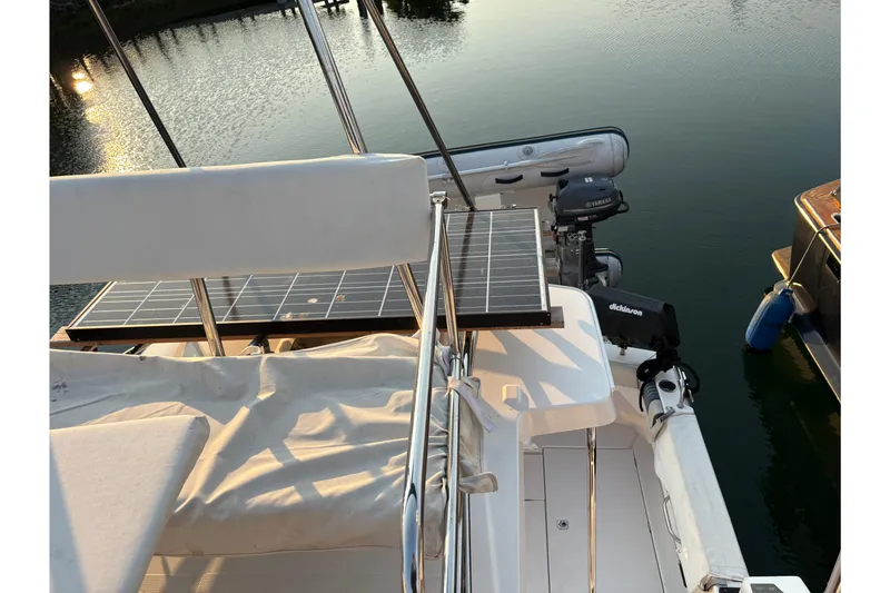 Slide: The Image of 2018 Cutwater C-30 CB boat with solar panel and outboard motor on calm water. - 60