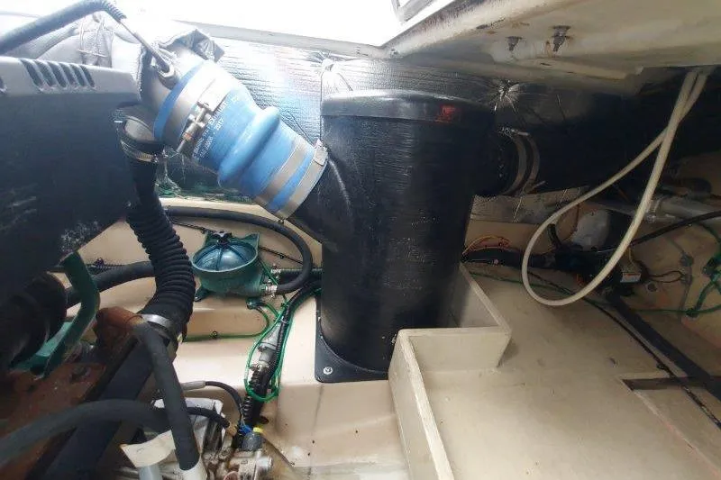 Slide: The Image of Engine compartment of a 2018 Cutwater C-30 CB boat, showing hoses and components. - 76