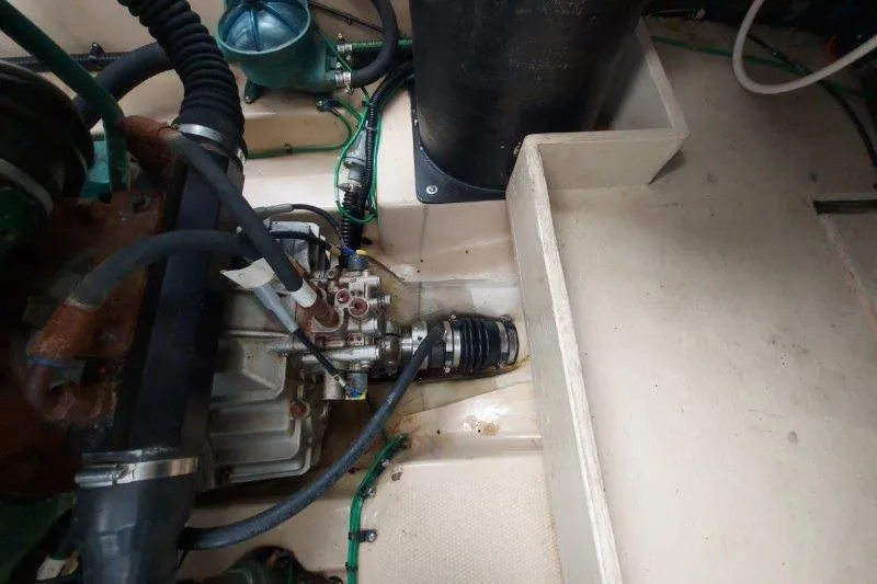 Slide: The Image of Engine compartment of 2018 Cutwater C-30 CB boat, showing mechanical components and hoses. - 77