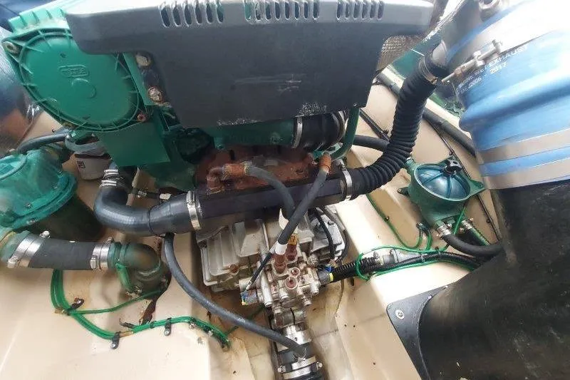 Slide: The Image of Engine compartment of a 2018 Cutwater C-30 CB boat, showcasing mechanical components and hoses. - 78