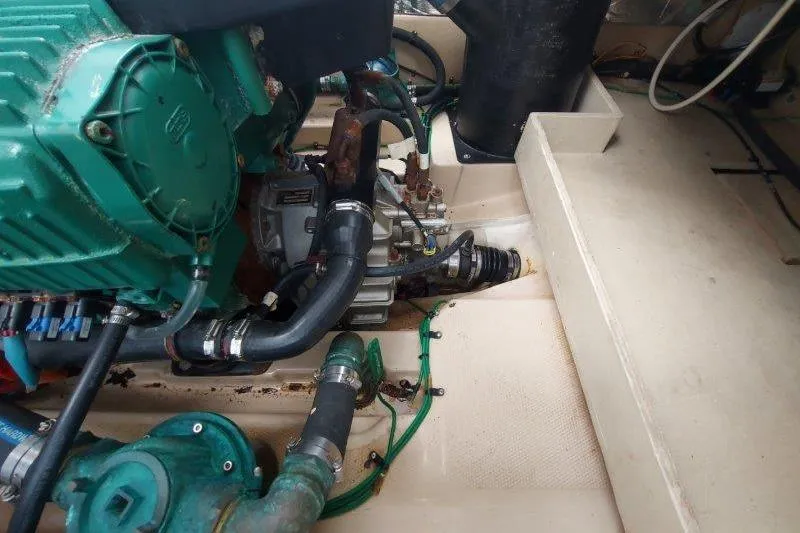 Slide: The Image of Engine compartment of a 2018 Cutwater C-30 CB boat, showing mechanical components and hoses. - 79